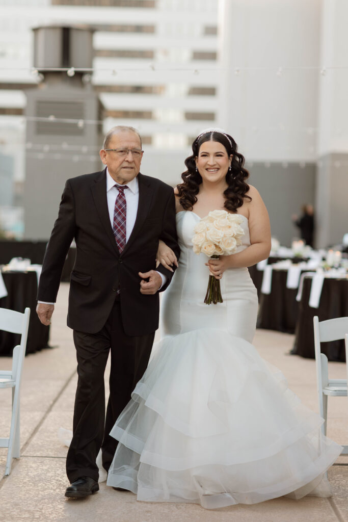 Bride and dad walking down the aisle at downtown Phoenix wedding venue