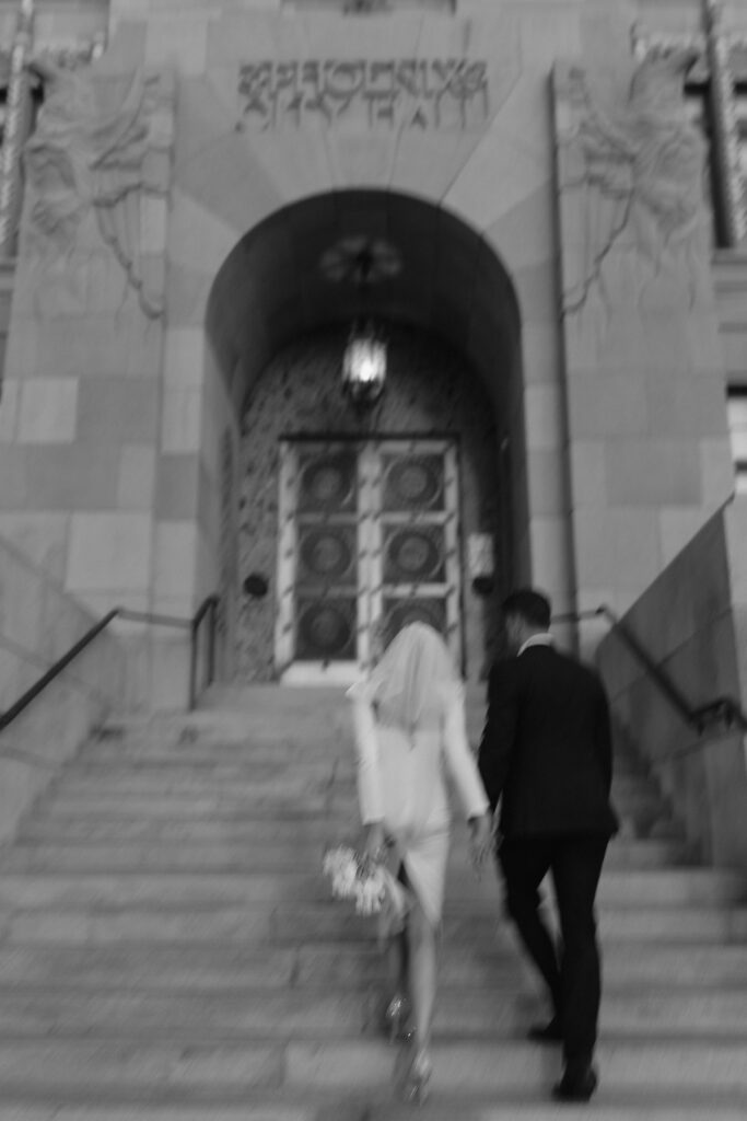 Bride & groom walking into the courthouse for a Phoenix wedding. Best Wedding Venues in AZ