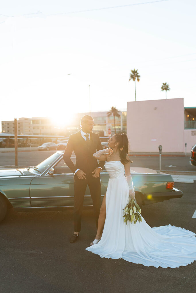 Sunset vibes with classic car and modern bride