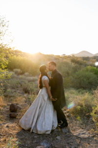 Indian couple in wedding attire during sunset in Arizona