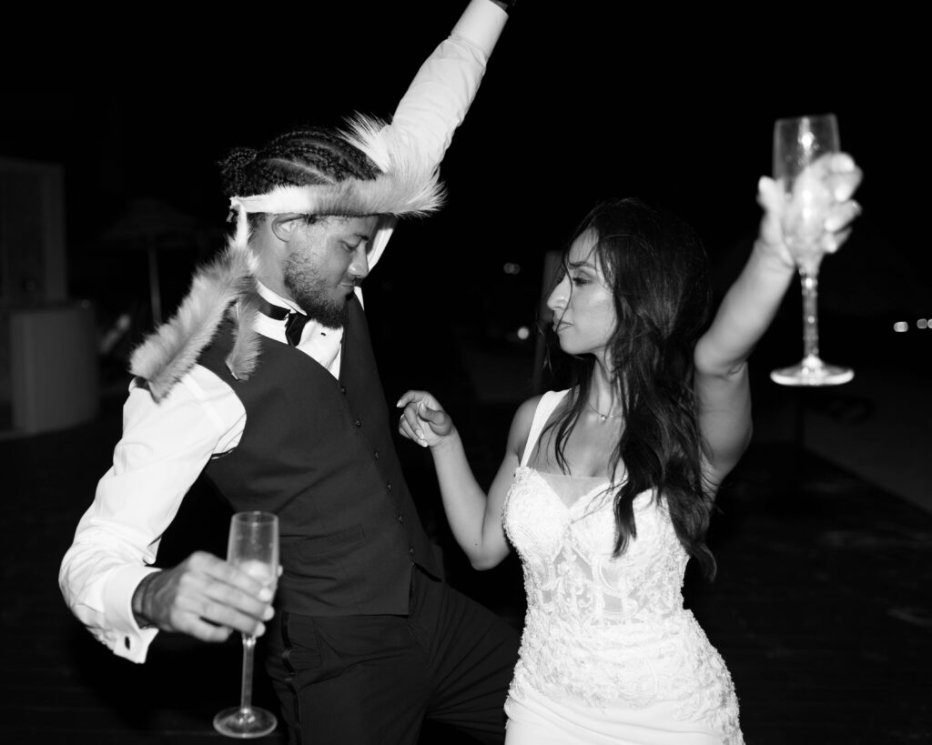 Bride and groom party after their destination wedding in Mexico wearing a white wedding gown and the groom in a traditional zulu headband