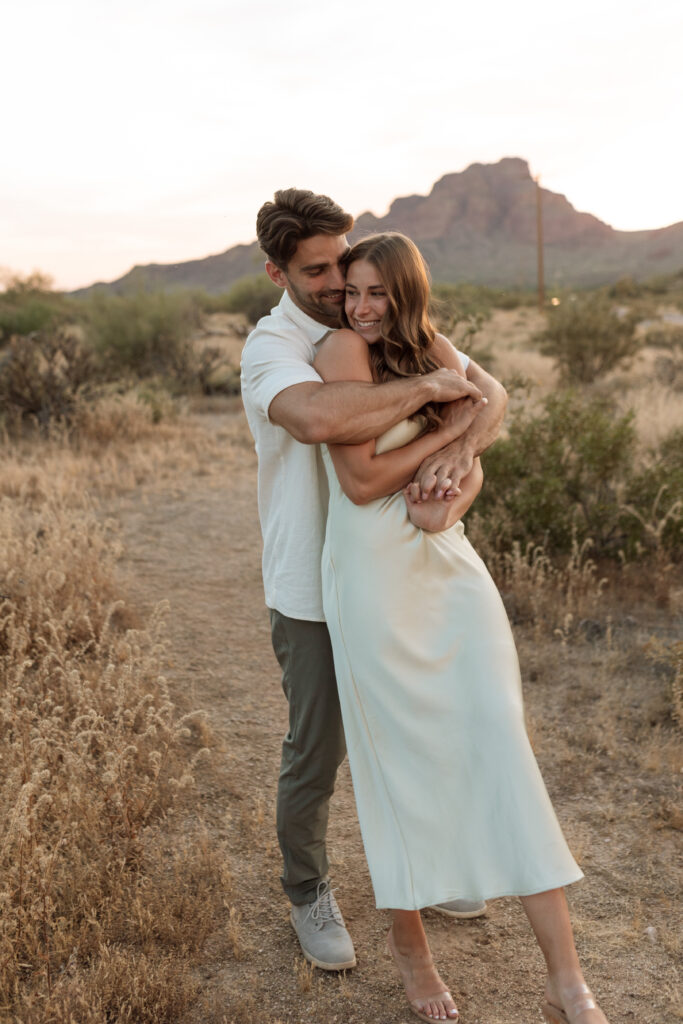 Engaged couple dancing in the Arizona desert